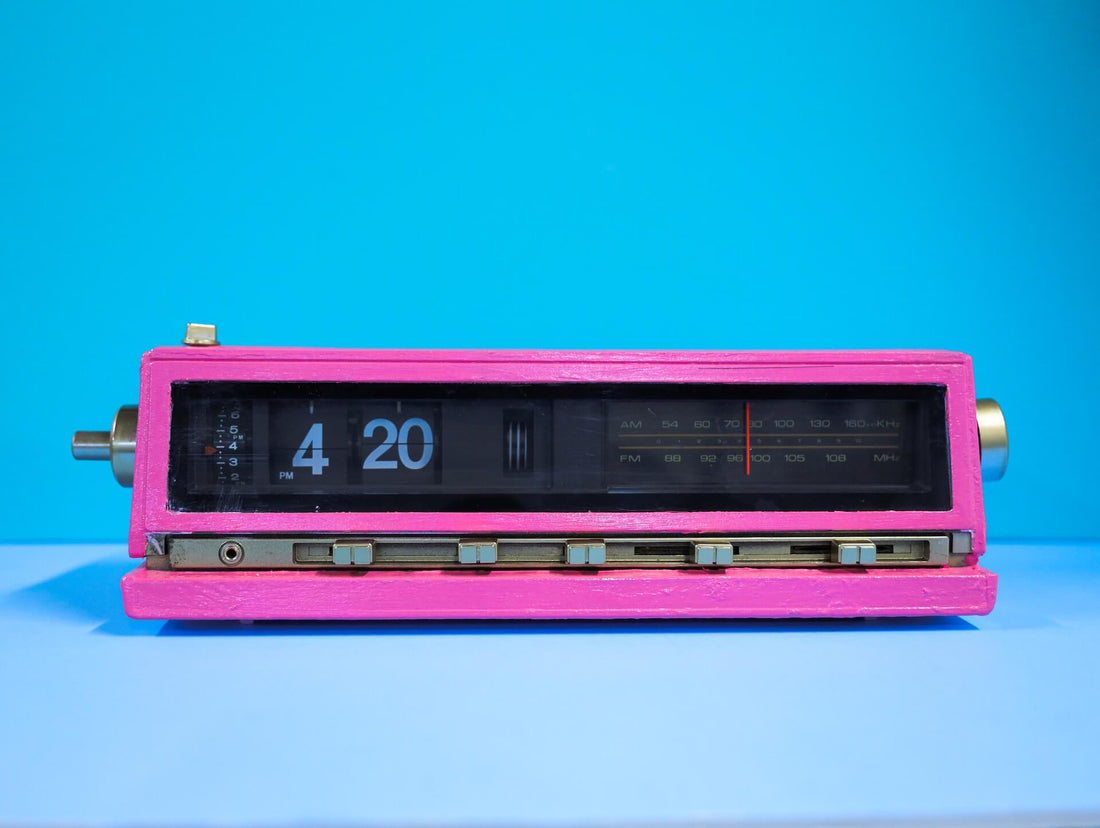An alarm clock displays the time 4:20 PM