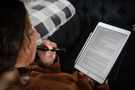 girl reading with dab pen
